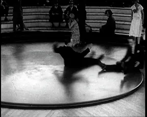 Rotating: A Group of People Sitting on a Large Rotating