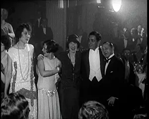 A Group of People Standing in a Nightclub with