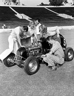 Racetracks: Group of people working on racecar