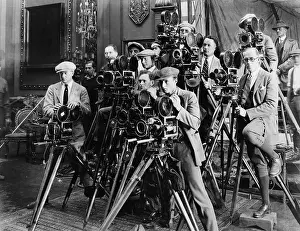 Cooperate: Group of photographers taking picture with cameras
