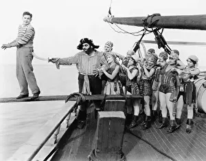 Terrify: Group of pirates trying to push a young man over a plank