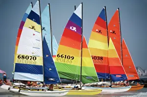 Colorfully: Group of sailboats with colorfully striped sails