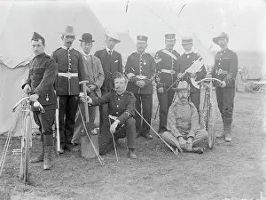 Kepi: Group of soldiers and civilians at a training camp