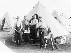 Stook: Group of four soldiers at a training camp