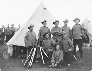 Stook: Group of eight soldiers at a training camp