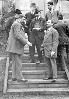 Hatmaking: Group on steps at house