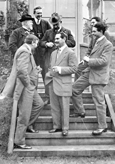 Hatmaking: Group on steps at house