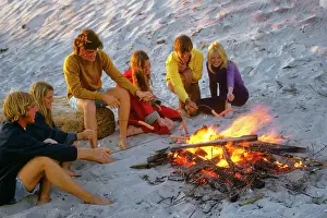 Pht001: Group Teens Around Campfire on Beach Roasting