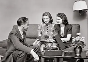 Vinyl: Group of Teens Two Girls One Boy Sitting Together