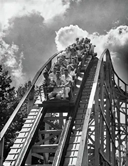 Lofty: Group of teens on roller coaster coming down