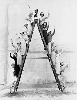 Rung: Group of women on tall ladder