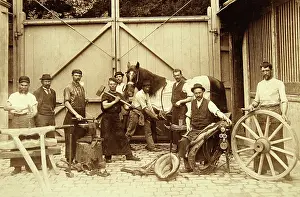 Blacksmithing: Group of workers in a blacksmith workshop