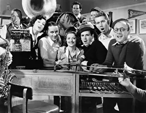 Grouping: Group of young musicians performing in a music store
