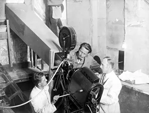 Projector: Guenther Rittau while setting up the projector of the TV pho