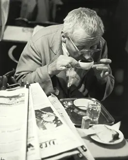 Hawelka: A guest drinking his coffee. Cafe