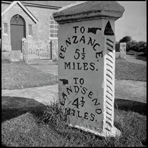 Milepost: Guide post standing at the crossroads in Crows-an-wra