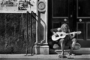 Itinerant: Guitarist on doorstep, Cadiz