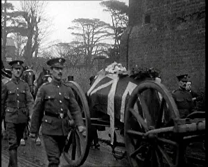 Flanked: A Gun Carriage Bearing a Coffin Draped in the