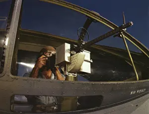 Unrecognizable: Gunner tries out a.30 caliber machine gun