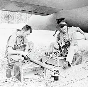 Clip: Gunners carefully clean their.50 caliber
