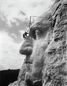 Traditionally: Gutzon Borglum inspecting work on the face