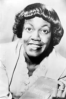Gwendolyn: Gwendolyn Brooks (1917-2000) holding her ?
