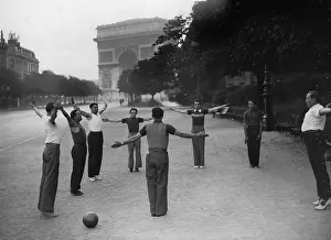 Fron: Gymnastics in front of the Arc de Triomphe