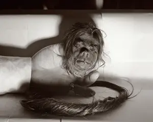 Shrunken: Hand Holding Shrunken Head from the Jivaro Tribe