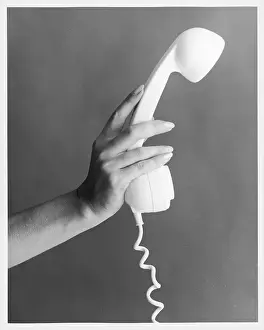 Manicured: HAND HOLDS A TELEPHONE