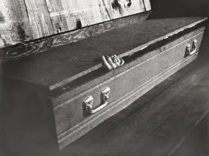 Nosy: Hand reaching out of coffin