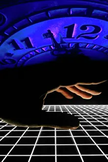 Ger002: Hand Reaching over A Grid Beneath A Blue Clock About