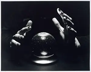 HANDS AND CRYSTAL BALL