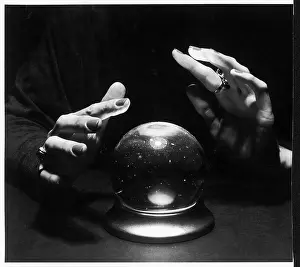 HANDS AND CRYSTAL BALL
