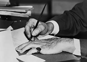 Signet: Hands of Franklin D. Roosevelt signing a ?