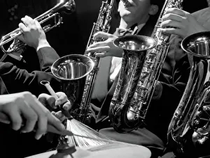 Hands of jazz combo playing saxophone trumpet