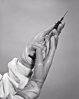 Providers: Hands Wearing Rubber Gloves Preparing to Administer