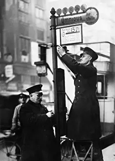 Fares: Hanging a sign with fares, 1934