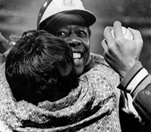 Dodgers: Hank Aaron is hugged by his mother after ?