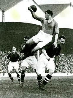 Header: Hapgood and Roberts of Arsenal, Dixie Dean of Everton