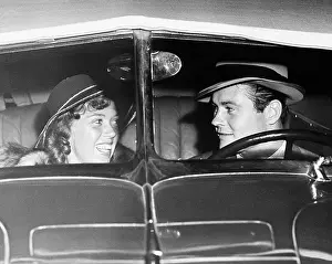Fedora: Happy couple in antique car