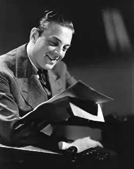 Engrossed: Happy man reading a letter