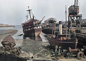 Neglected: Harbour scene with ships and equipment, Scotland