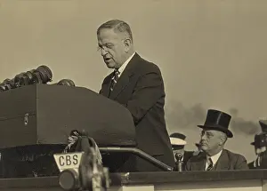Urging: Harold L. Ickes, at the lectern with President