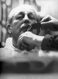 Toppers: Harold Macmillan at the barbers