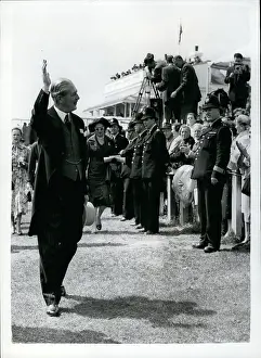 Acknowledges: Harold Macmillan PM at Epsom Derby