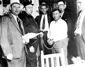 Manacled: Harry F.Powers (R), the murderer, manacled ?