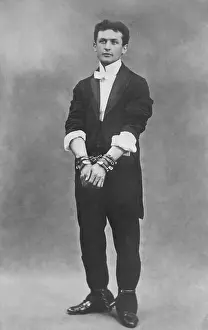 Illusionists: Harry Houdini, escapologist, in chains