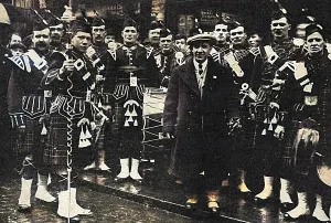 Kilted: Harry Lauder with his recruiting pipe band, WW1
