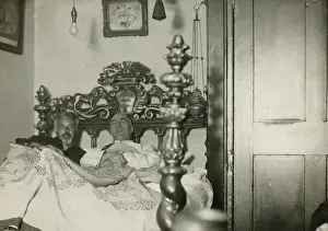 Quilt: Harry Price and C. E. M. Joad lying in and investigating a s