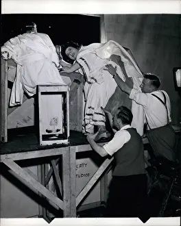 Outsize: Hattie Jacques on step ladder with prop men